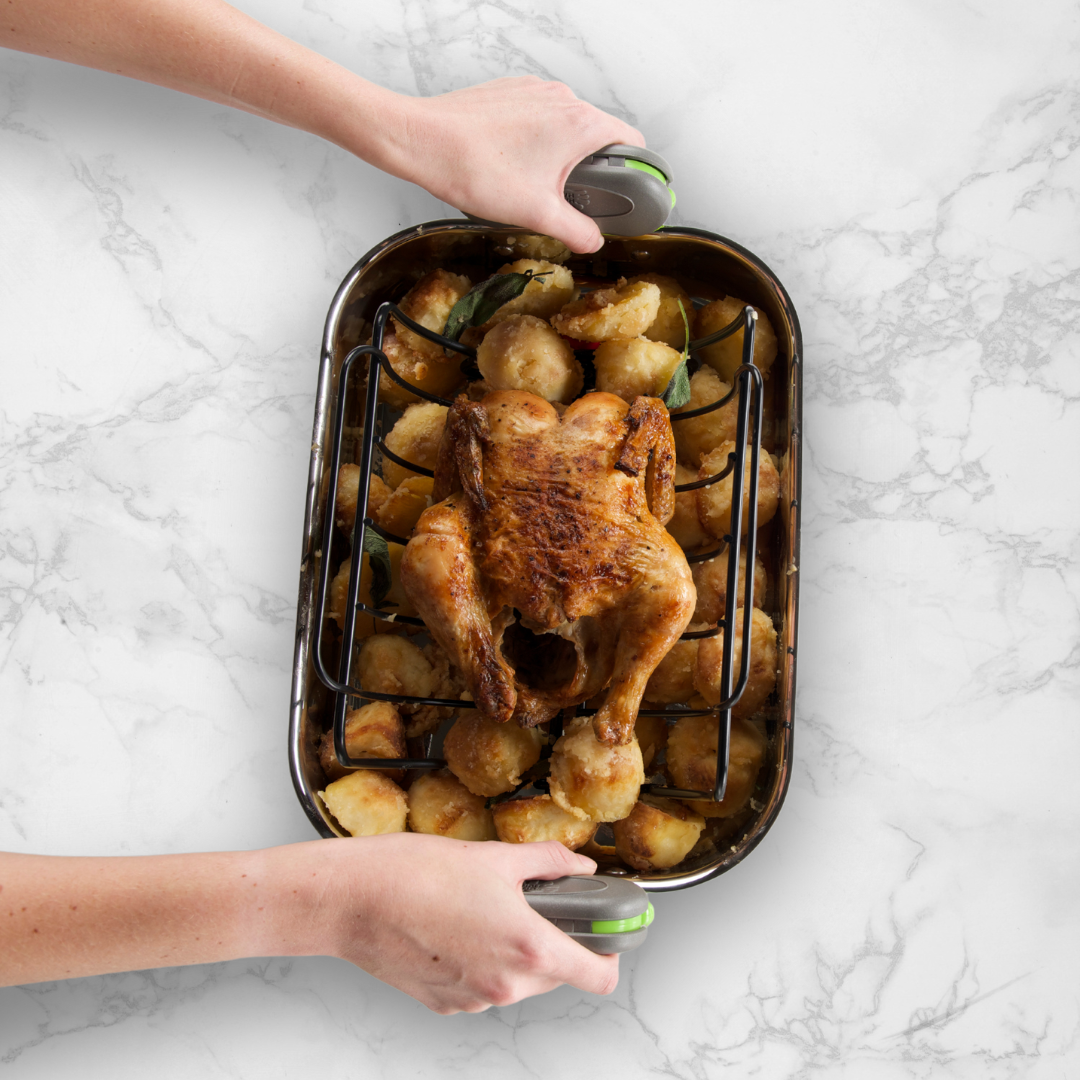 PebbleGrip in Green being used to move a roast chicken.